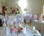 Gorgeous table displays of phalanopsis orchids, roses etc with matching vases