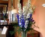 Corporate delphinium vase display in The Garden Room